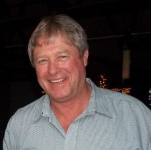 Man in blue shirt smiling