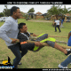 team members carrying a man